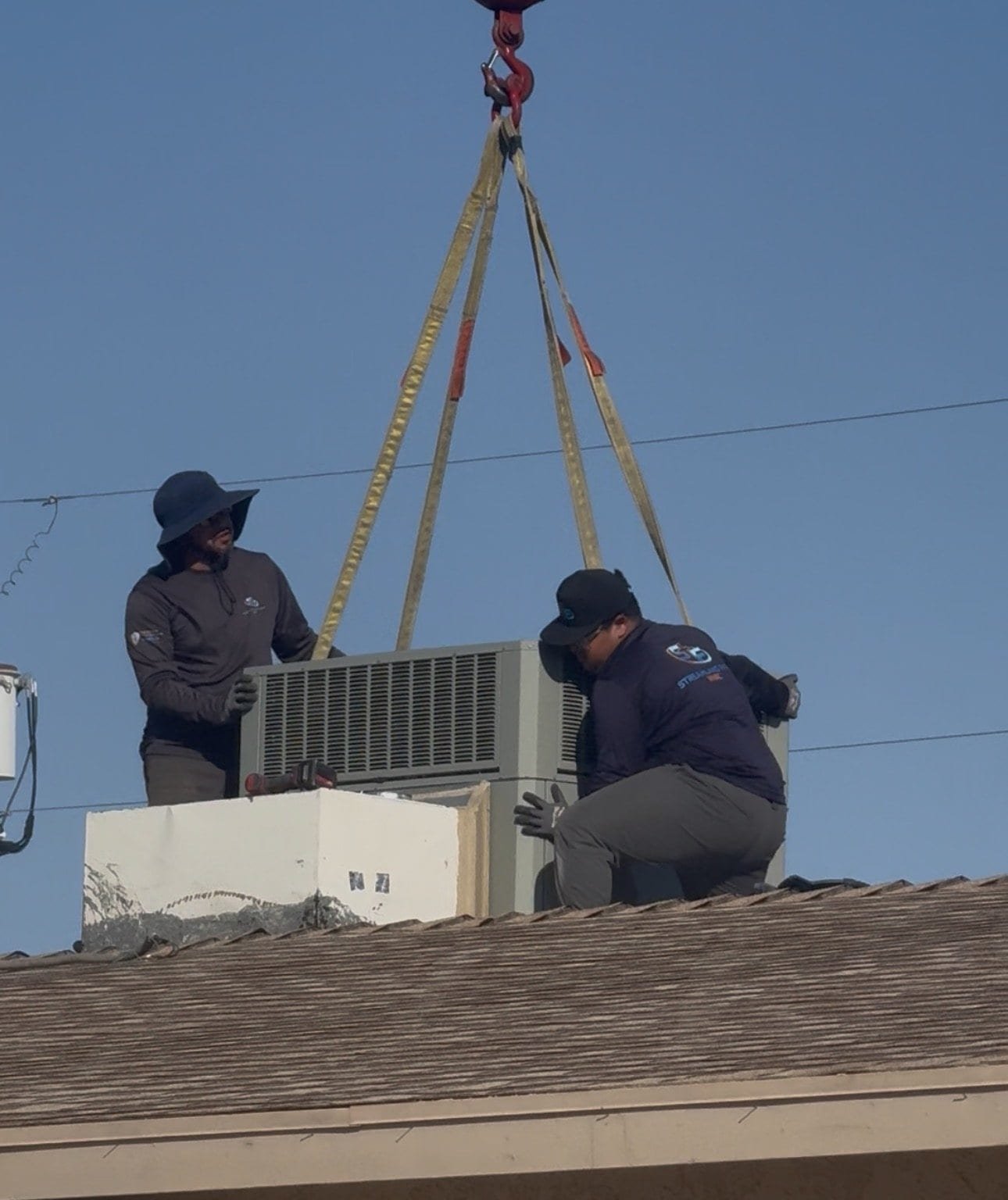 Package unit replacement lifted onto a Lake Havasu roof