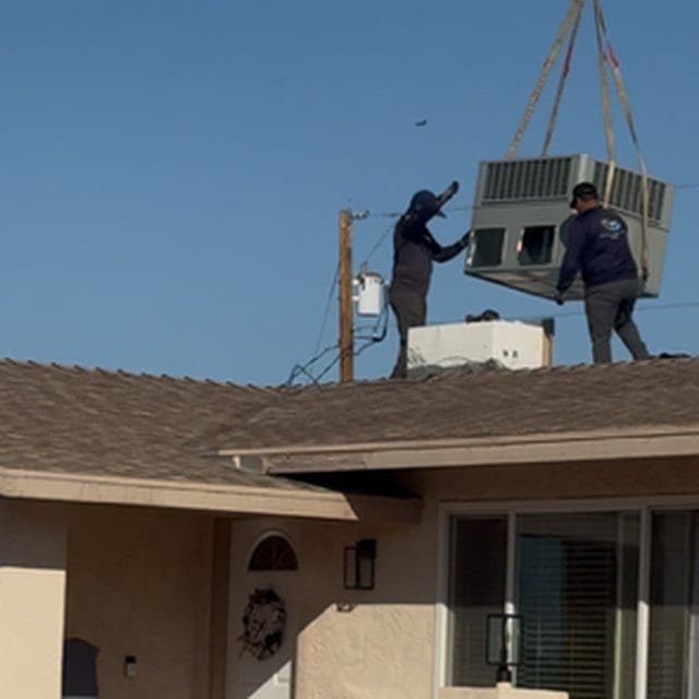 Replacement package unit being lowered into rooftop position