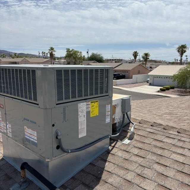Rooftop package unit installed on a shingle roof
